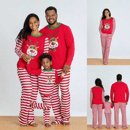 Young boy wearing a red and white striped long-sleeved pajama set with a reindeer graphic on the chest. - Image 4