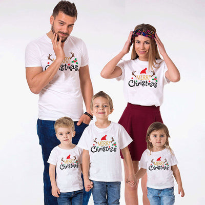 Family matching white Christmas t-shirts and baby bodysuit with 'Merry Christmas' graphic, paired with black and white plaid pajama bottoms. - Image 17