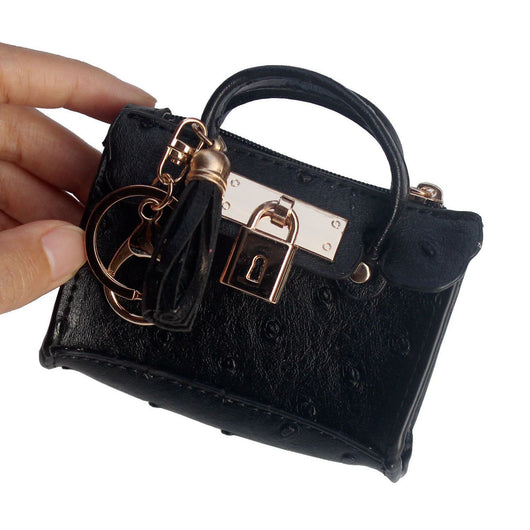 Bolso de Mano Minimalista en Cuero con Borlas - Image 4