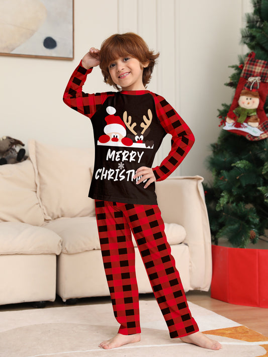 Family of four wearing matching red and black buffalo plaid Christmas pajamas with reindeer graphic. - Image 2