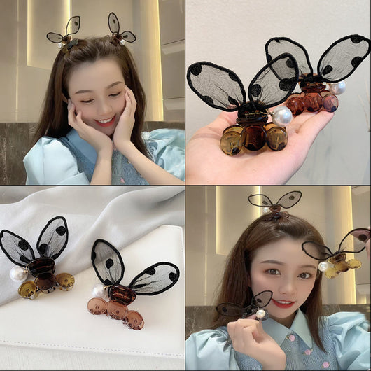 Black sheer polka dot rabbit ears hair claw clip with a faux pearl and gold-toned metal accents. - Image 11