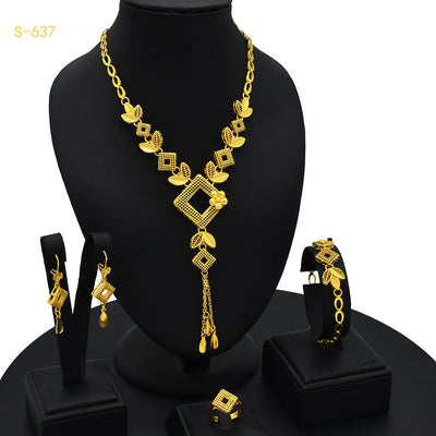Ornate gold-colored bridal jewelry set with filigree design, including a necklace, drop earrings, bracelet, and ring. - Image 3