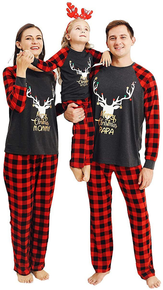 Woman wearing a Christmas pajama set with a dark gray 'Merry Christmas MOMMY' reindeer top and red and black plaid pants. - Image 23