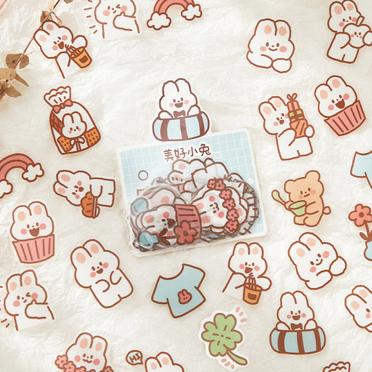 40-piece pack of cute white bunny PET stickers with pink outlines, showing the bunny in various activities like driving, fishing, and holding flowers, on a pink - Image 3