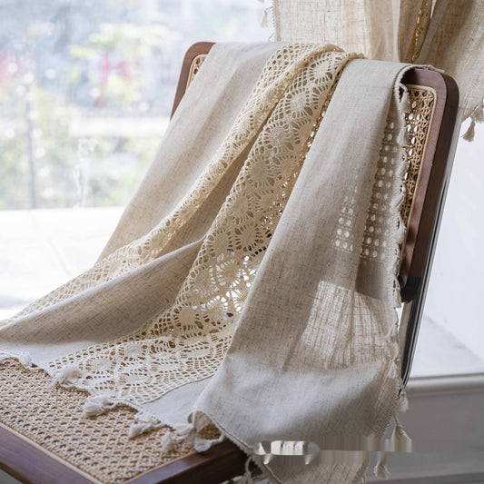 Beige crochet and plaid stitching short curtain with tassels, made from polyester cotton, hanging in a cozy room.
