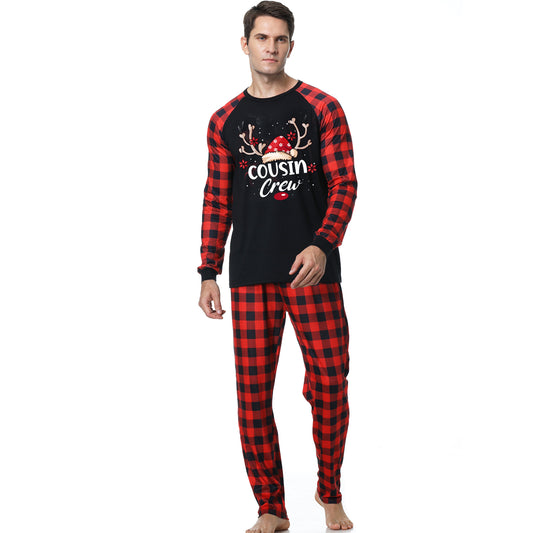 Kids' black and red buffalo plaid Christmas pajamas with 'Cousin Crew' graphic and reindeer antlers. - Image 2