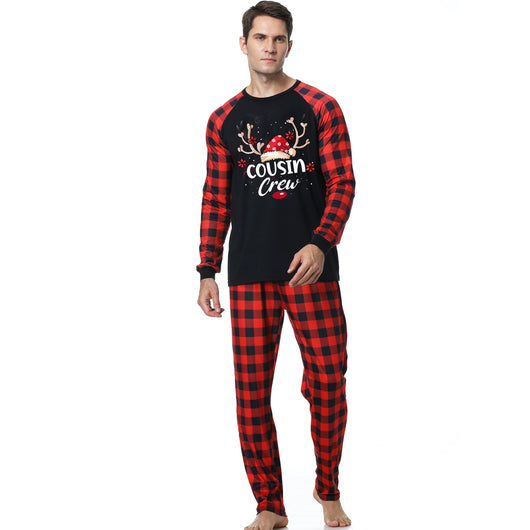 Kids' black and red buffalo plaid Christmas pajamas with 'Cousin Crew' graphic and reindeer antlers. - Image 2