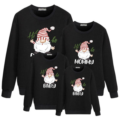 Family matching white long-sleeve crew neck tops with a cute snowman face print, featuring black eyes, an orange carrot nose, and a dotted smile. One adult top - Image 3