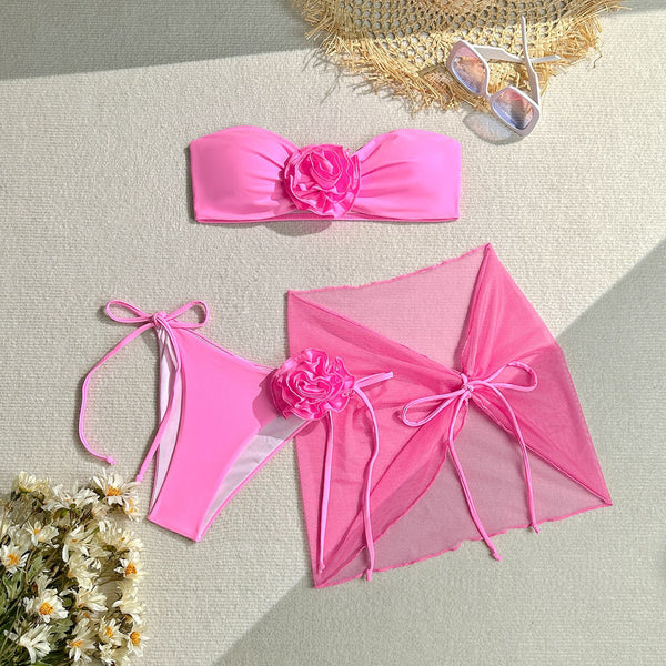 Women's blue tube top swimsuit with a large 3D flower, tie-side bikini bottoms, and a sheer sarong skirt. - Image 6