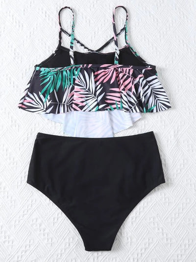 Women's split swimsuit with a black high-waisted bikini bottom and a flounced tankini top featuring a green, blue, and white tropical leaf print. - Image 20