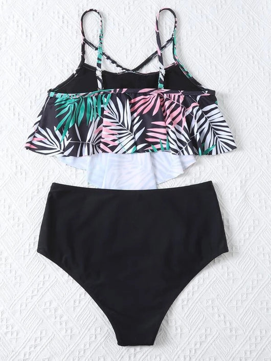 Women's split swimsuit with a black high-waisted bikini bottom and a flounced tankini top featuring a green, blue, and white tropical leaf print. - Image 20