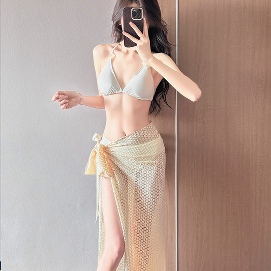 Women's light purple three-piece bikini set with a triangle halter top, bottoms, and a mesh sarong with rose details. - Image 2
