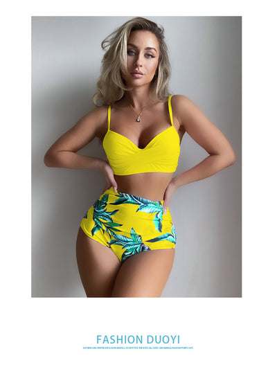 Woman wearing a bright yellow push-up bikini top and high-waisted bottoms with a green tropical leaf print. - Image 15