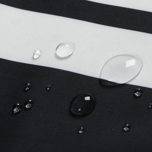 Black and white striped polyester shower curtain with a crown and text design, hanging from a silver tension rod. - Image 9