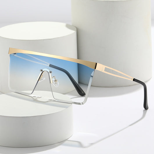 Gold frame square sunglasses with a one-piece gradient blue lens and black temple tips.