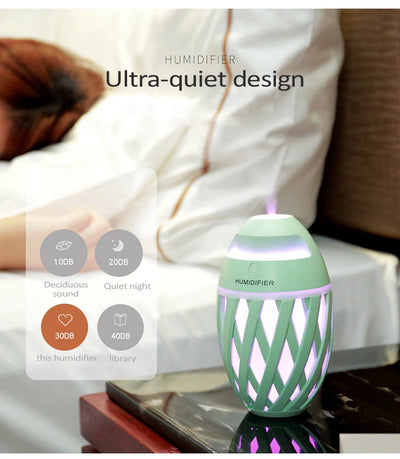 Light green football-shaped humidifier with a decorative lattice pattern and a power button on top. - Image 16