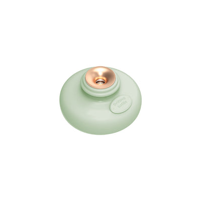 Three 'Drift bottle' humidifiers in white, mint green, and pink, floating in water and emitting mist. - Image 12