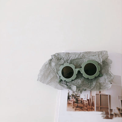 Orange flower-shaped sunglasses for babies and toddlers with dark lenses and a plastic frame. - Image 16
