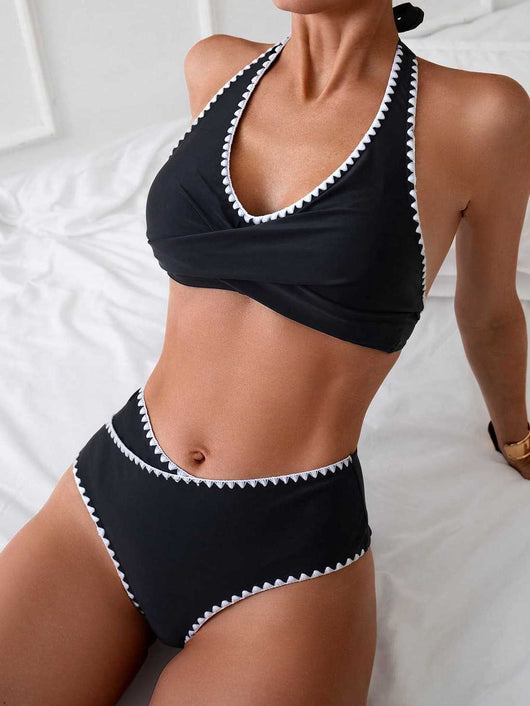 Black two-piece swimsuit with white scalloped trim, featuring a halter neck wrap-front top and high-waisted bottoms. - Image 8