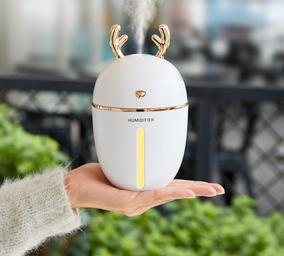 Pink deer-shaped ultrasonic humidifier with gold antlers, a white USB fan, and a white USB light. - Image 8