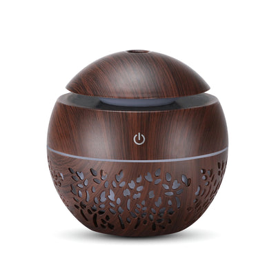 Dark wood grain mini ultrasonic humidifier with a mushroom shape and decorative hollow-out pattern. - Image 8