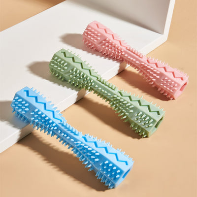 Pink textured dog chew toy with nubs and ridges for teeth cleaning, designed like a stick with a hollow center. - Image 4