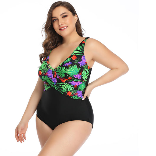 Plus size one-piece swimsuit with a red tropical leaf print top and solid dark red bottom, featuring a crossover chest. - Image 5