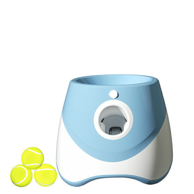 Two automatic dog ball throwers, one yellow and white, one green and white, on a wooden desk. - Image 9