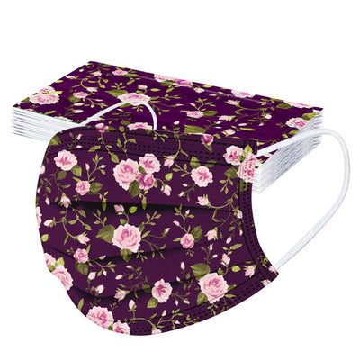Stack of disposable facial masks with a watercolor floral pattern of red, pink, and orange roses and green leaves. - Image 18