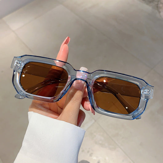 Black square-frame sunglasses with thick, angular frames and dark blue lenses, shown on a white background. - Image 3