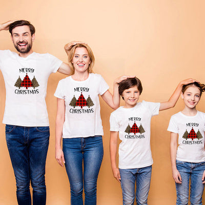 Family matching white Christmas t-shirts and baby bodysuit with 'Merry Christmas' graphic, paired with black and white plaid pajama bottoms. - Image 10
