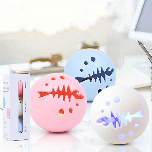 Three-pack of cat toy balls, including a pink fishbone-patterned ball, a mint ball, and a flashing ball. - Image 8