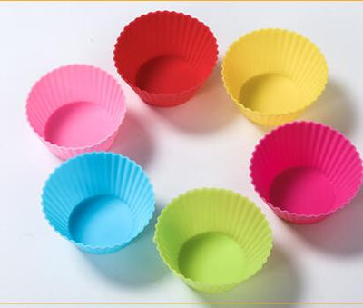 Six colorful silicone cupcake liners in red, blue, hot pink, yellow, pink, and lime green on a white background. - Image 10