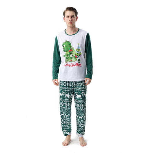 Woman in a Christmas pajama set with a white top, green sleeves, dinosaur graphic, and green fair isle pants. - Image 10