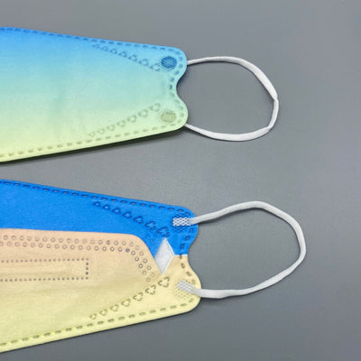 Gradient pink and purple fish-type 4D protective mask with white ear loops on a gray background. - Image 13