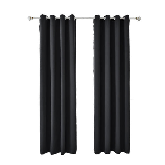 Light gray polyester blackout curtains with grommet tops hanging on a white rod in a modern living room. - Image 2