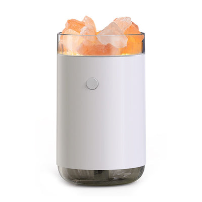 Pink cylindrical humidifier and essential oil diffuser with glowing orange crystal salt stones and a clear base. - Image 8