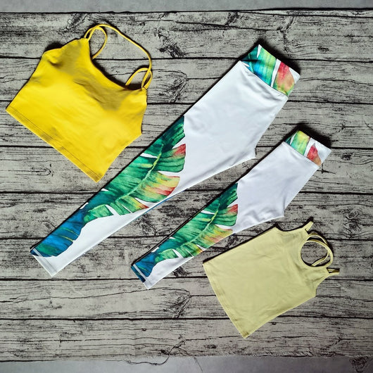 White parent-child yoga suit with tropical leaf print leggings and matching sleeveless tops. - Image 21