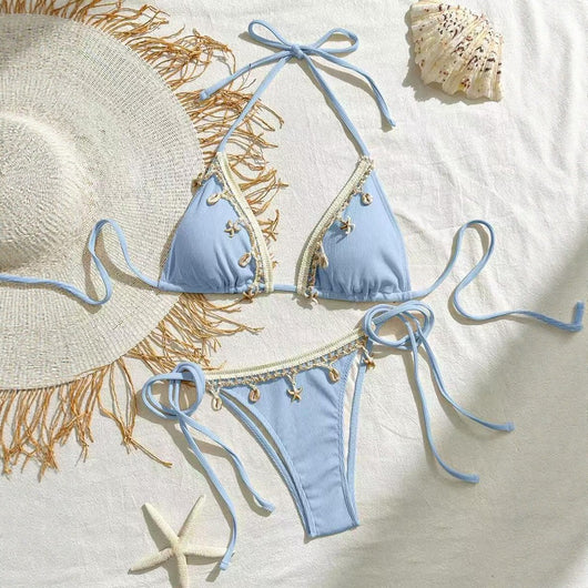 Light pink ribbed halterneck bikini with triangle cups and tie-side bottom, adorned with shell and starfish charms. - Image 4
