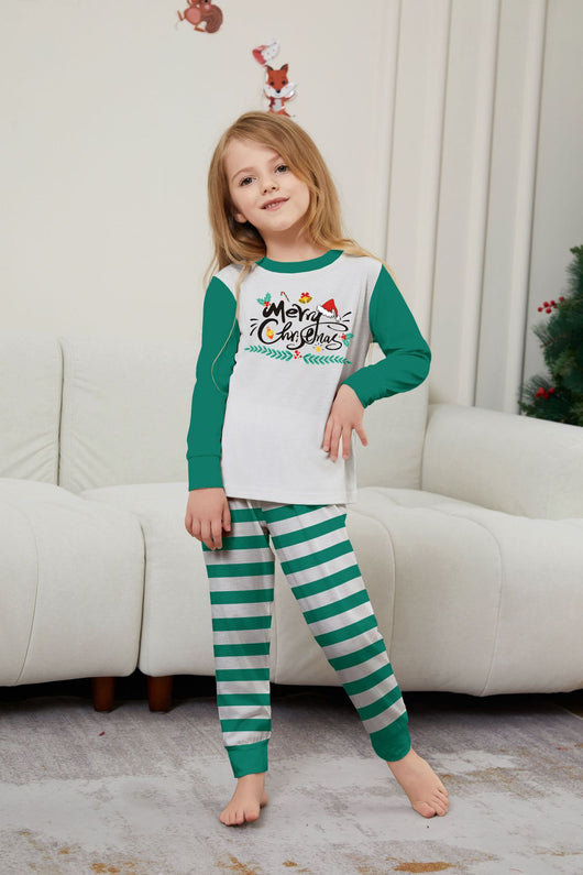 Family of four wearing matching green and white striped Christmas pajamas with "Merry Christmas" graphic. - Image 21