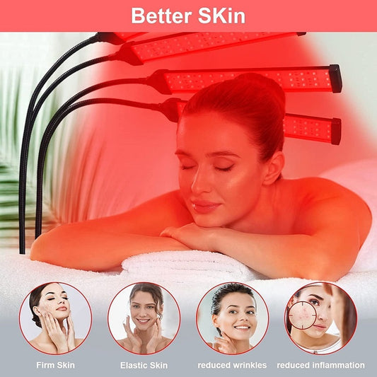 Red light therapy lamp with four adjustable arms illuminating a person lying on a white massage table. - Image 2