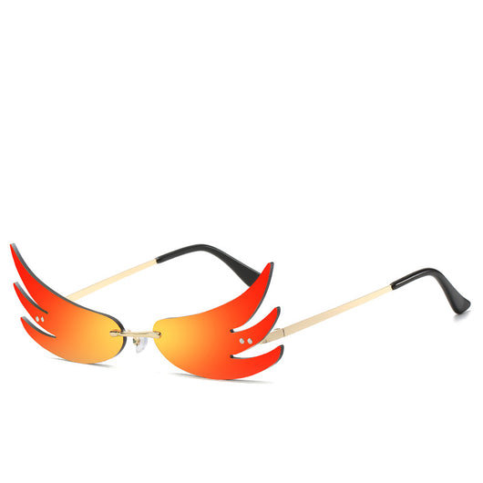 Rimless flame-shaped sunglasses with silver reflective lenses, gold metal temples, and black temple tips. - Image 3