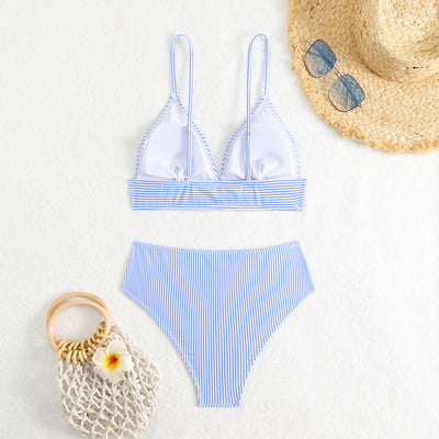 Green and white striped two-piece bikini with a triangle top and high-waisted bottoms on a woman. - Image 19