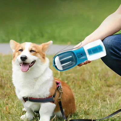 Purple 3-in-1 portable pet water bottle with food compartment, waste bag dispenser, and lanyard. - Image 5