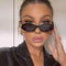 Retro Feline Sunglasses with Angular Design and Cheetah Silhouette