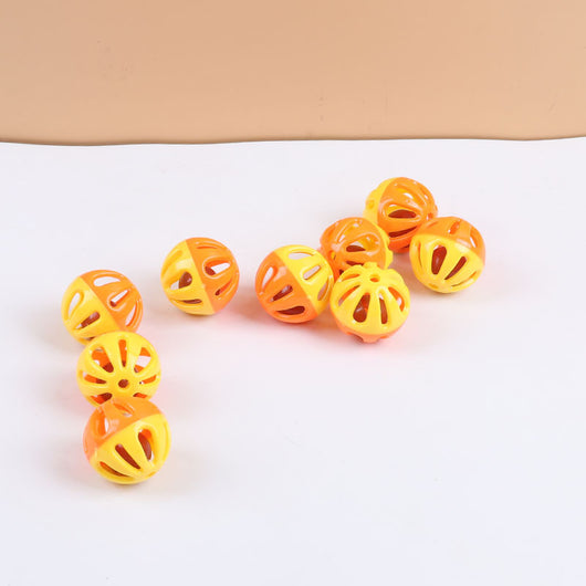 Five colorful plastic pet bell balls in red, yellow/orange, lime green, and hot pink, with hollow designs. - Image 4