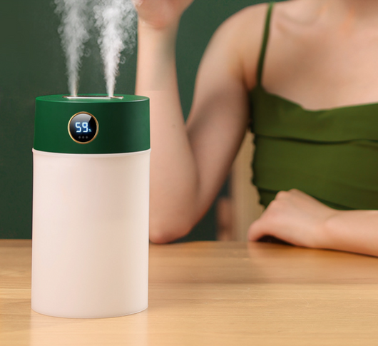 White cylindrical humidifier with a gold nozzle emitting mist, featuring a subtle bear emblem. Includes five aromatherapy oil bottles. - Image 13