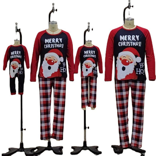 Family matching Christmas pajamas with Santa Claus graphic and "Merry Christmas!" text on black and red tops, paired with red and black plaid pants. - Image 9