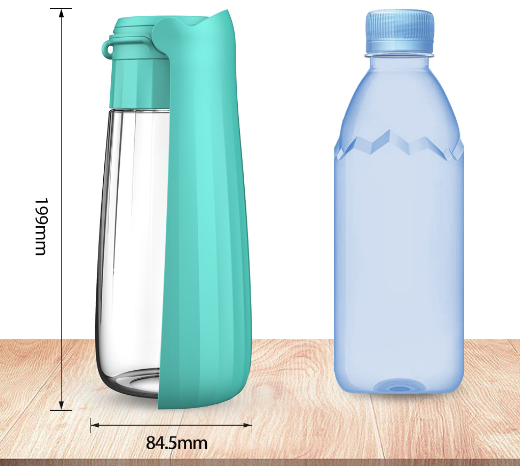 Yellow 450ml portable pet water bottle with a folding drinking trough and white wrist strap, on grass. - Image 12
