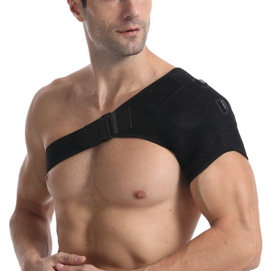 Man wearing a black electric heating shoulder pad with adjustable straps for therapeutic warmth and support. - Image 4